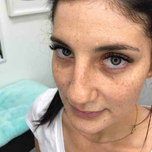 Eyewonderlust Cleaning Your Eyelash Extensions Blog - Woman with Long Dark Wavy Lashes Closeup