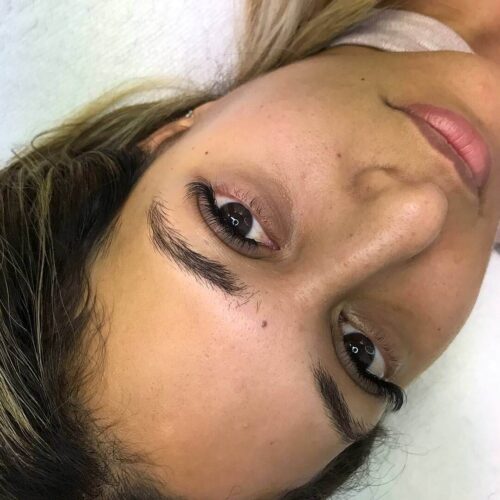 Eyewonderlust Difference Between Good and Bad Set of Eyelash Extensions Blog - Female Closeup with Long Bowed Black Eyelashes
